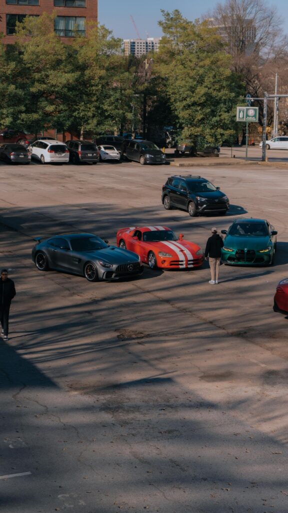 Supercars Meetup in Sunny Parking Lot High-Quality Phone Wallpaper
