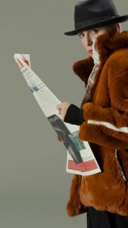 Chic Fashion Model in Faux Fur Coat and Fedora Hat Mobile Wallpaper