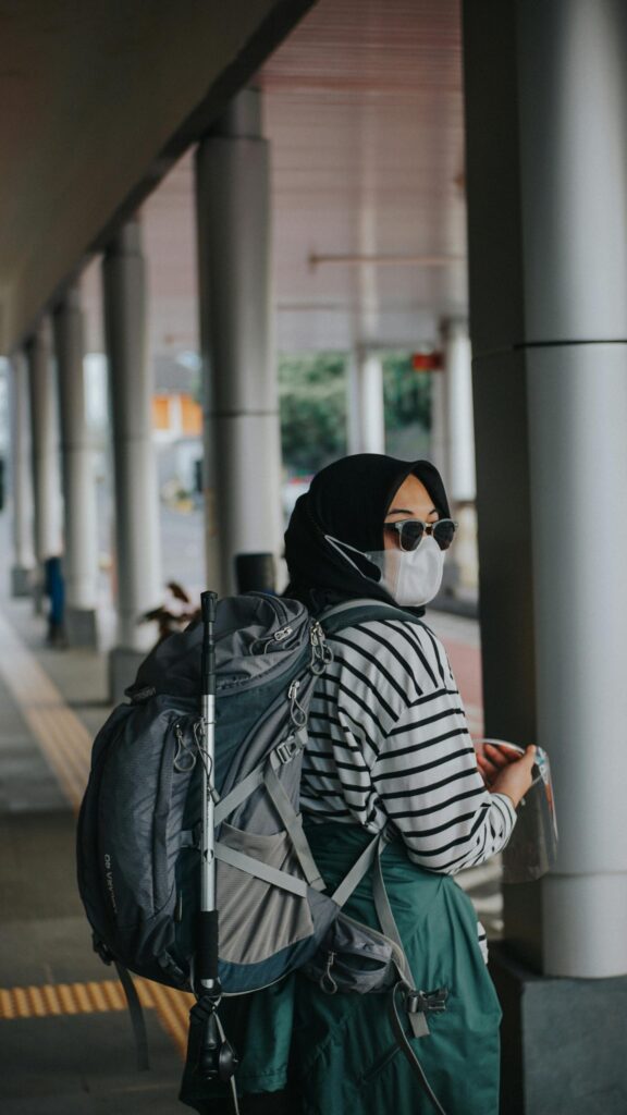 Woman Traveler with Backpack and Hijab Mobile Phone Wallpaper