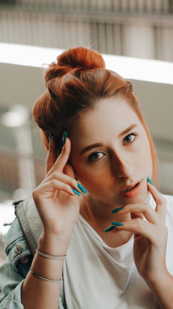 Beautiful Redhead Woman with Teal Nails Portrait Mobile Wallpaper