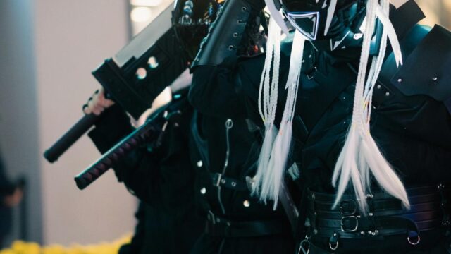 Cyberpunk Cosplay Warriors with Futuristic Swords Mobile Wallpaper