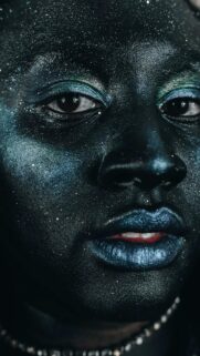 Stunning Black Skin with Shimmering Blue Glitter Macro Portrait Wallpaper