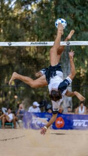 Athletic Footvolley Player Aerial Kick Action Mobile Wallpaper