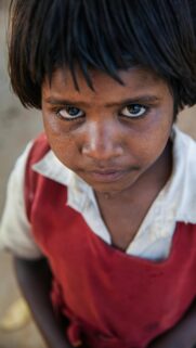 Portrait of a Serious Young Girl with Expressive Eyes Mobile Wallpaper