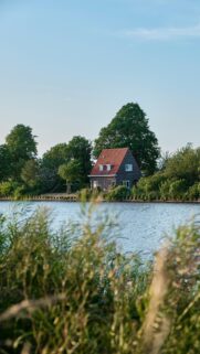 Serene Dutch House by the Canal Vertical Mobile Wallpaper