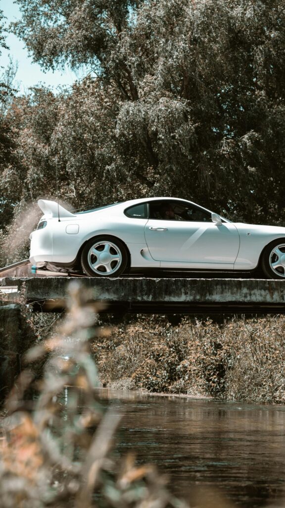 White Toyota Supra on Bridge Scenic Nature Mobile Wallpaper