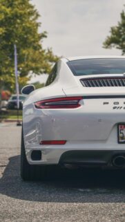 Sleek White Porsche 911 Rear View Luxury Sports Car Mobile Wallpaper