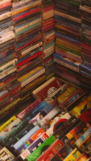 High-Angle Stacked Book Collection Aesthetic Mobile Wallpaper