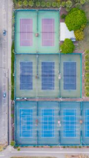 Aerial Drone View of Vibrant Tennis Courts Mobile Wallpaper
