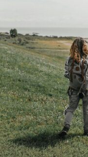 Woman Hiking in Nature with Backpack Phone Wallpaper