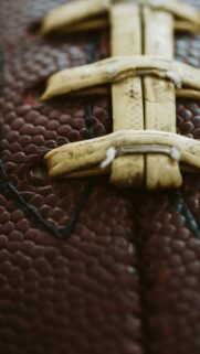 Macro Close-Up of American Football Laces Texture Phone Wallpaper