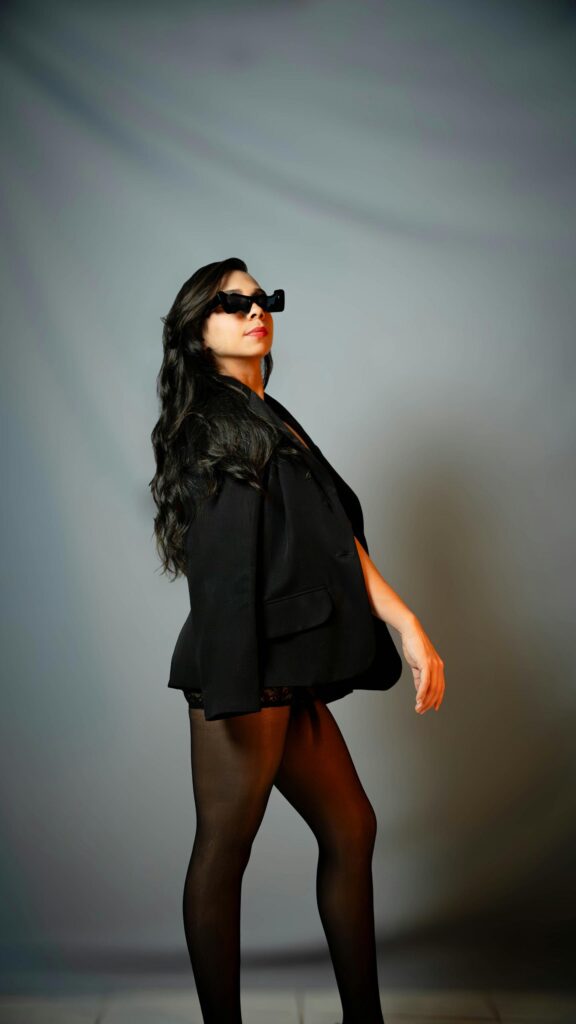 Chic Woman in Black Blazer and Sunglasses Portrait Mobile Wallpaper
