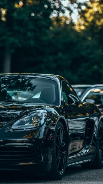 Sleek Black Porsche 718 Cayman Sportscar Mobile Wallpaper