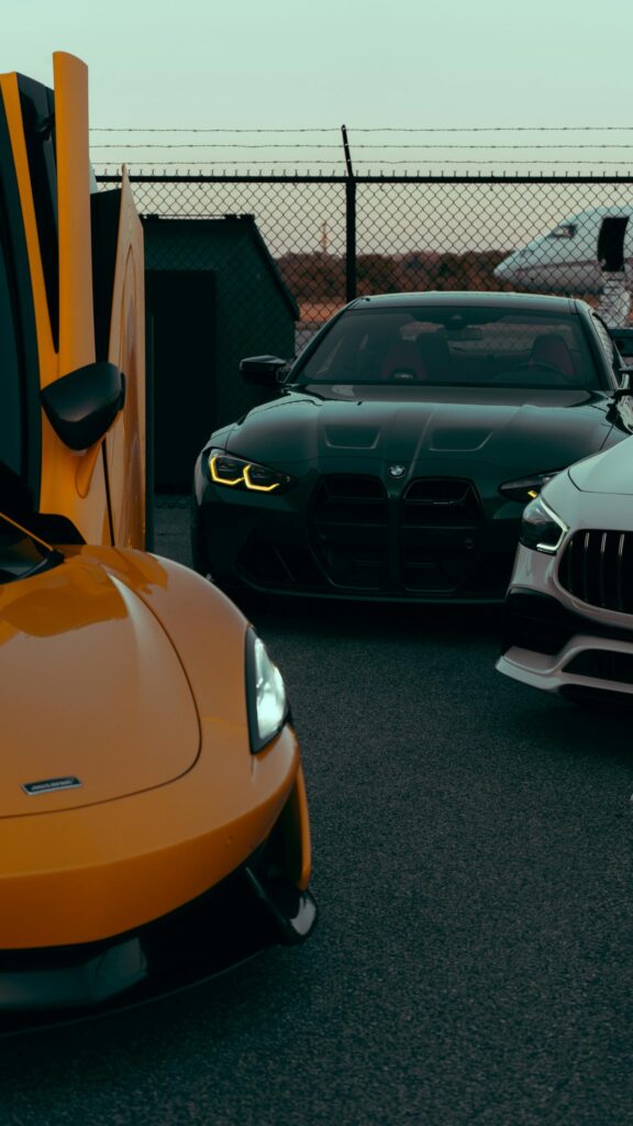 McLaren, BMW M4, and Mercedes-AMG Luxury Sports Cars Phone Wallpaper