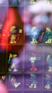 Vintage Smurfs Collection Display Retro Aesthetic Phone Wallpaper