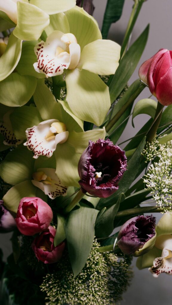 Stunning Floral Bouquet with Green Orchids and Purple Tulips Mobile Wallpaper