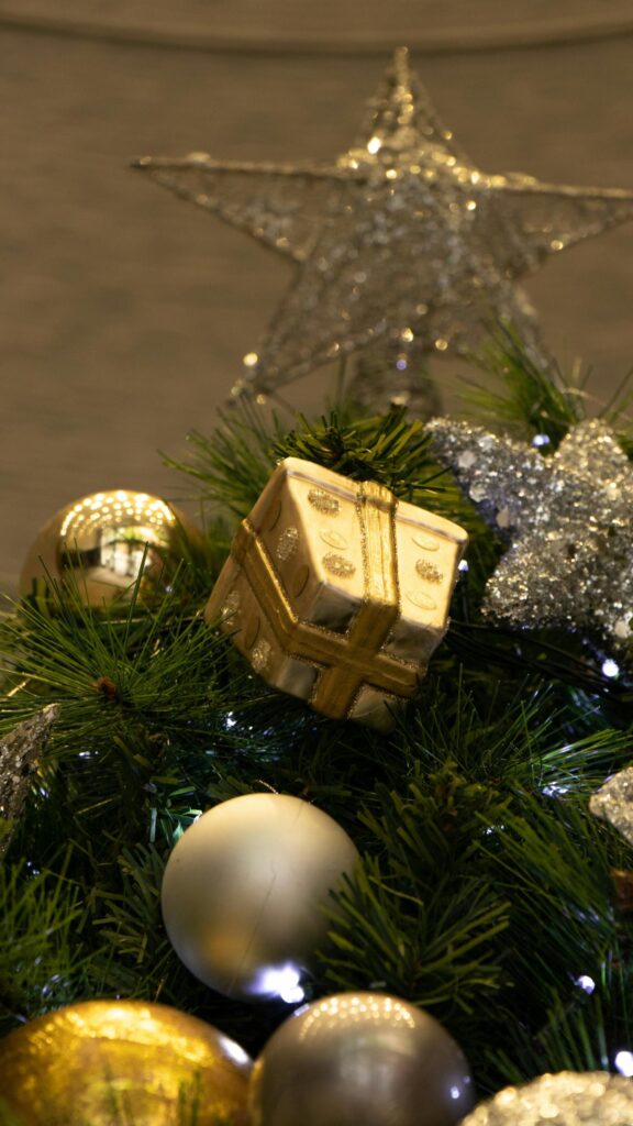Golden Christmas Gift and Sparkling Ornaments Festive Phone Wallpaper
