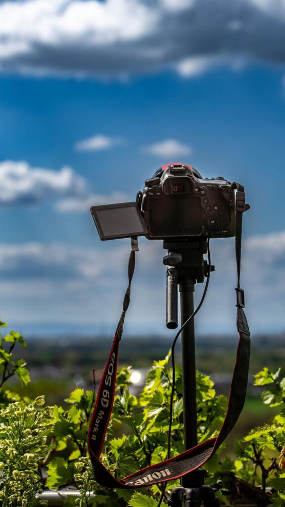 Professional Canon Camera on Tripod Scenic Sky Nature Wallpaper