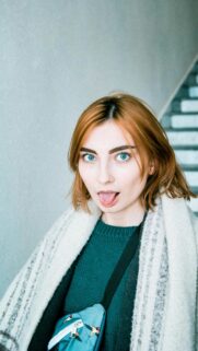 Cute Redhead Girl Making Funny Face Portrait Mobile Wallpaper