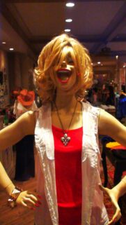 Lively Mannequin Portrait with Vibrant Red Tank Top Mobile Wallpaper