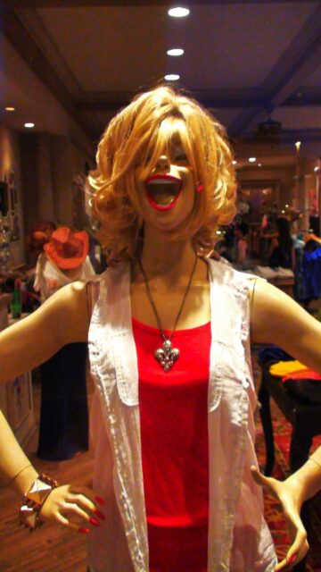 Lively Mannequin Portrait with Vibrant Red Tank Top Mobile Wallpaper