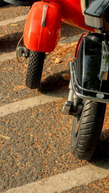 Vespa Scooter Front Tire Close-Up Stylish Urban Mobile Wallpaper