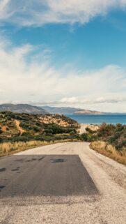 Scenic Coastal Road Leading to the Mediterranean Sea Mobile Wallpaper