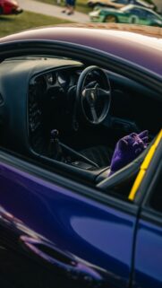 Purple JDM Sports Car Interior with Gengar Plushie Phone Wallpaper