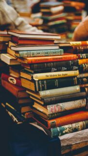 A Stack of Antique Vintage Books Aesthetic Mobile Wallpaper