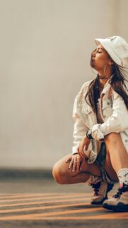 Stylish Streetwear Girl in Bucket Hat Aesthetic Phone Wallpaper
