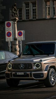 Champagne Gold Mercedes-AMG G-Wagon in Swiss City Street Wallpaper