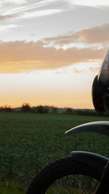 Motorcycle at Golden Hour Field Scenic Mobile Wallpaper