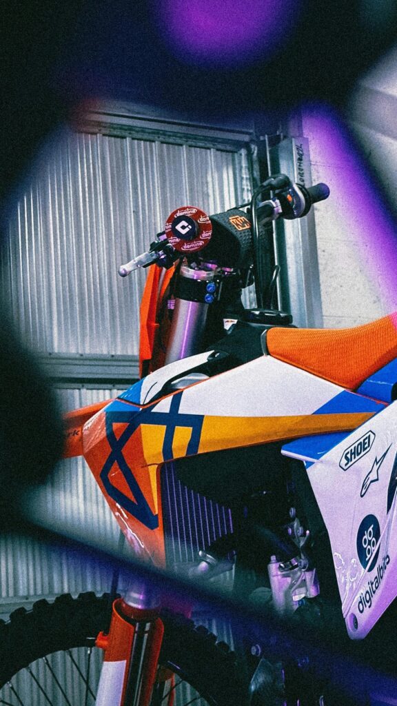 Orange and Blue Motocross Bike Close Up Mobile Wallpaper