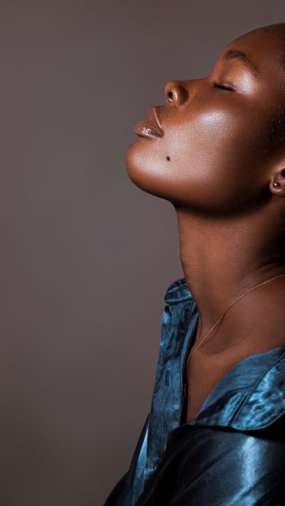 Stunning Close-Up Portrait of Beautiful Woman with Glowing Skin Wallpaper