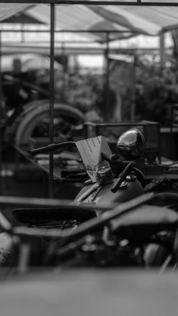 Vintage Motorcycle Handlebars and Headlight Black and White Mobile Wallpaper