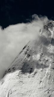 Snowy Mountain Peak Piercing Through Clouds Minimalist Mobile Wallpaper