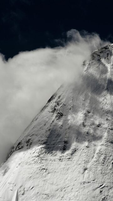 Snowy Mountain Peak Piercing Through Clouds Minimalist Mobile Wallpaper