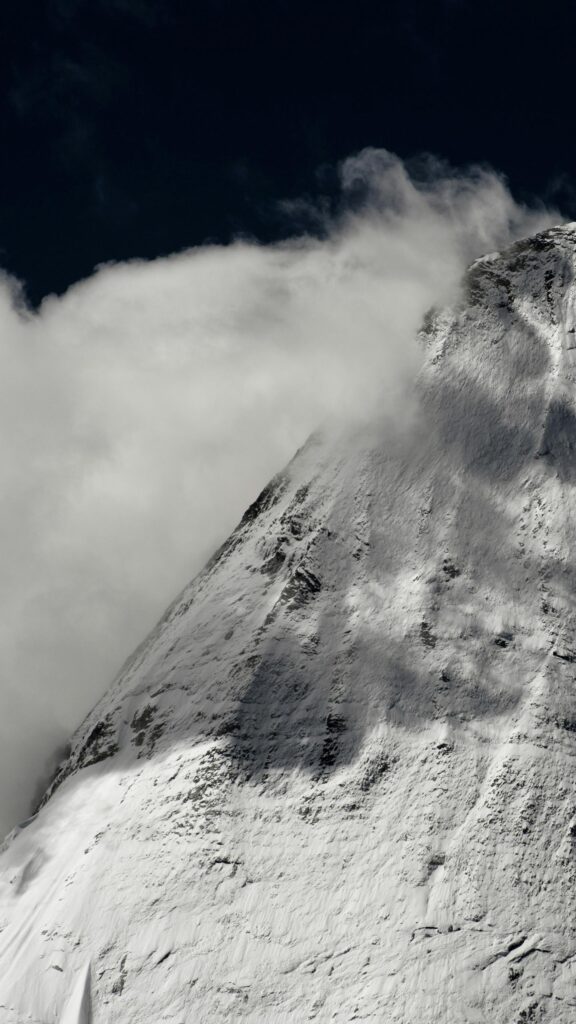 Snowy Mountain Peak Piercing Through Clouds Minimalist Mobile Wallpaper