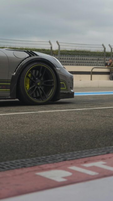 Grey Porsche Racing Car with Neon Accents Mobile Wallpaper