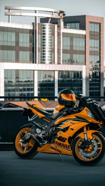 Stunning Yellow Yamaha R6 Sportbike with Helmet Mobile Wallpaper