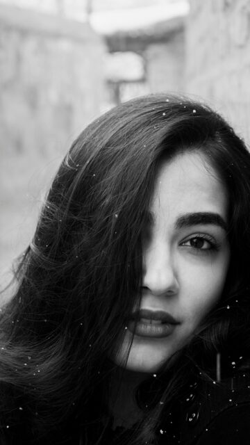 Stunning Portrait of a Woman with Snowflakes Mobile Wallpaper