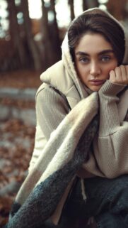 Sad Woman in Beige Winter Hooded Outfit Aesthetic Phone Wallpaper
