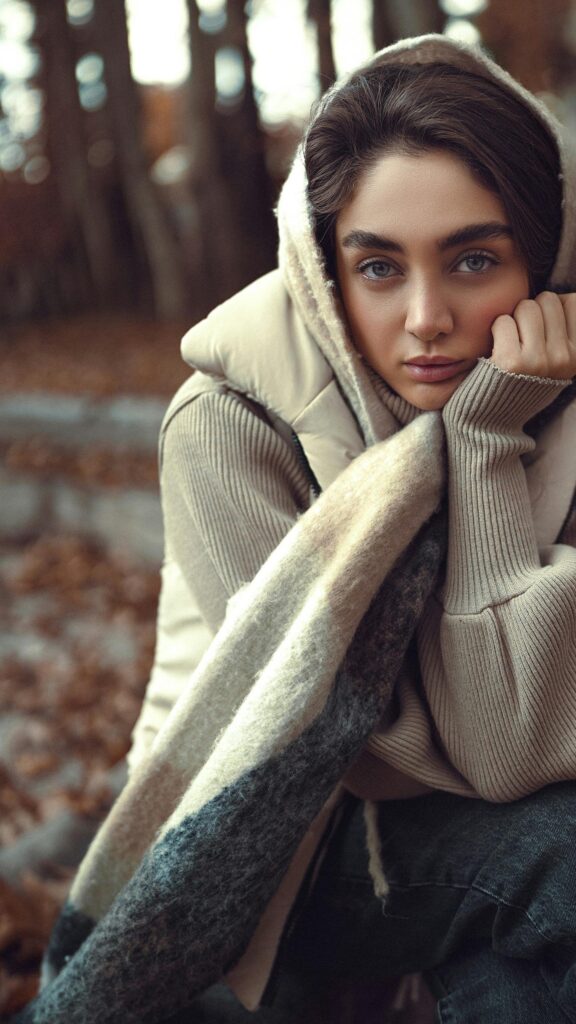 Sad Woman in Beige Winter Hooded Outfit Aesthetic Phone Wallpaper