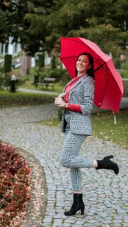 Stylish Woman with Red Umbrella in Houndstooth Suit Mobile Wallpaper