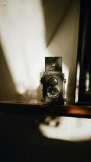 Vintage Voigtländer Camera on Wooden Shelf Aesthetic Mobile Wallpaper