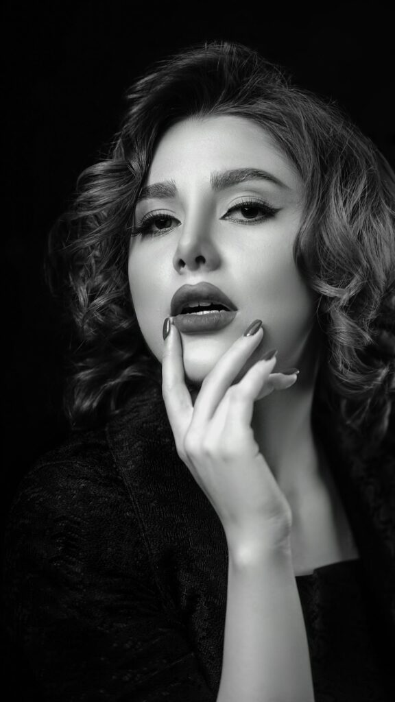 Stunning Black and White Portrait of a Glamorous Woman Phone Wallpaper