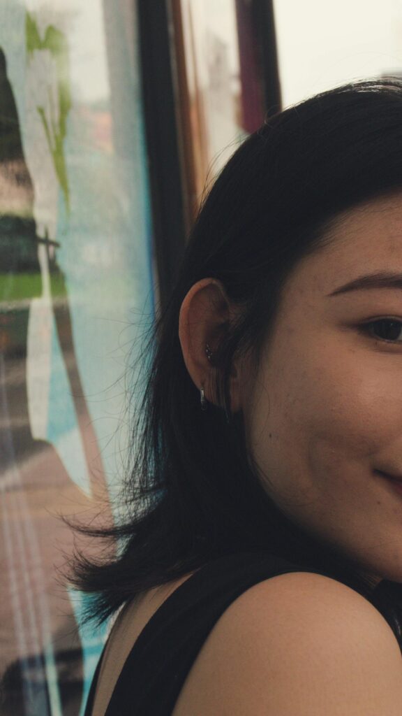 Beautiful Young Asian Woman With Elegant Ear Piercings Wallpaper