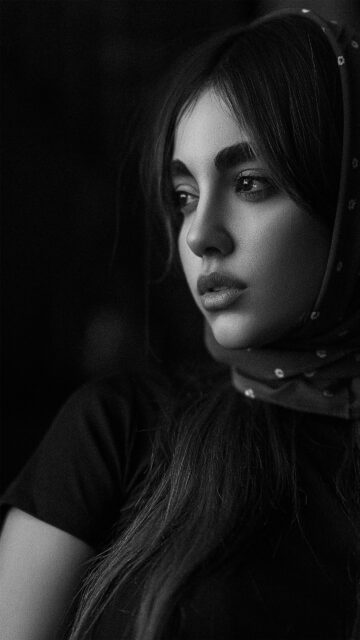 Stunning Portrait of a Mysterious Young Woman in Black and White Wallpaper