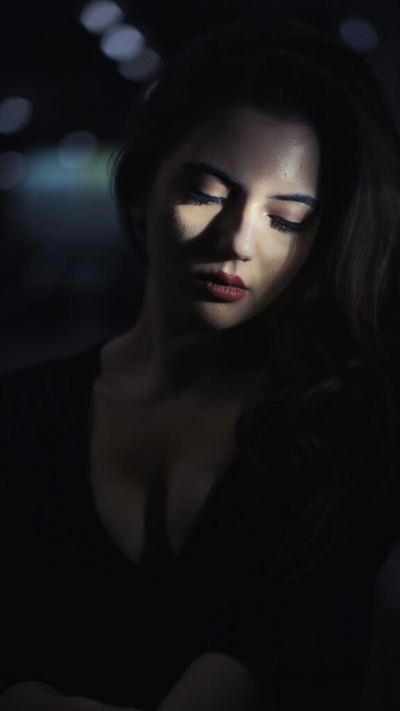 Elegant Woman in Dark Moody Portrait Free Mobile Wallpaper