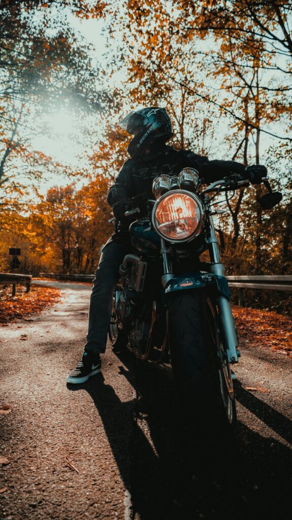 Autumn Biker Journey on a Classic Motorcycle Mobile Wallpaper